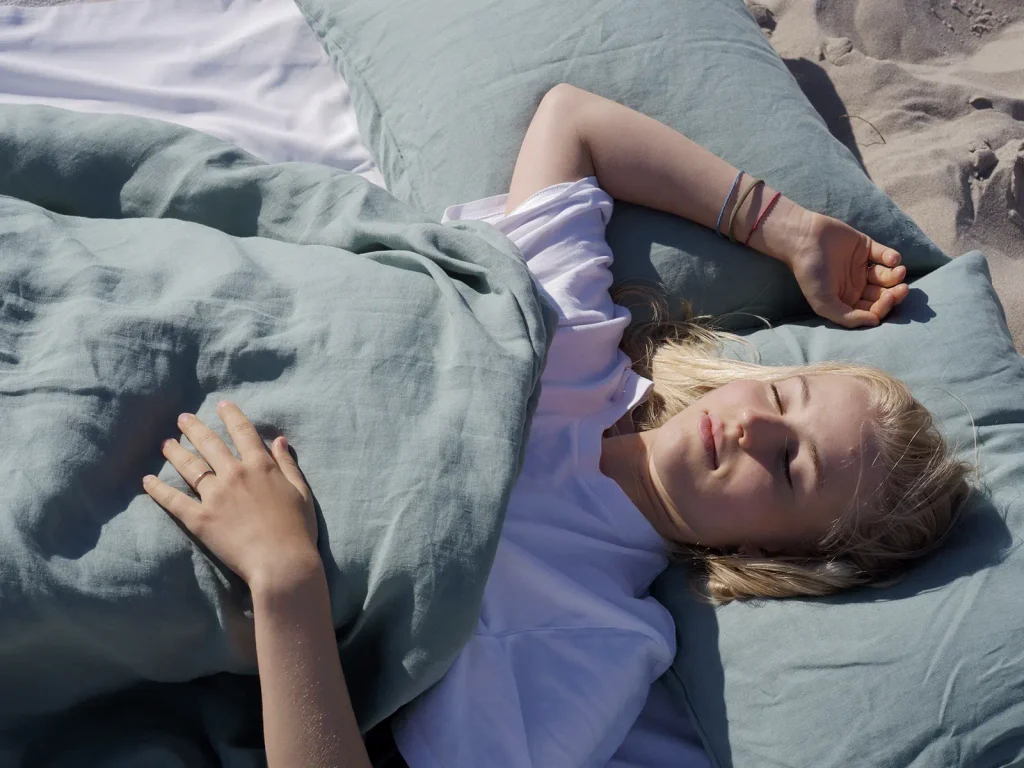 Snooze european linen bedding in a calm solid colour on the beach
